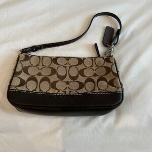 Brown coach purse, minor damage on the bottom